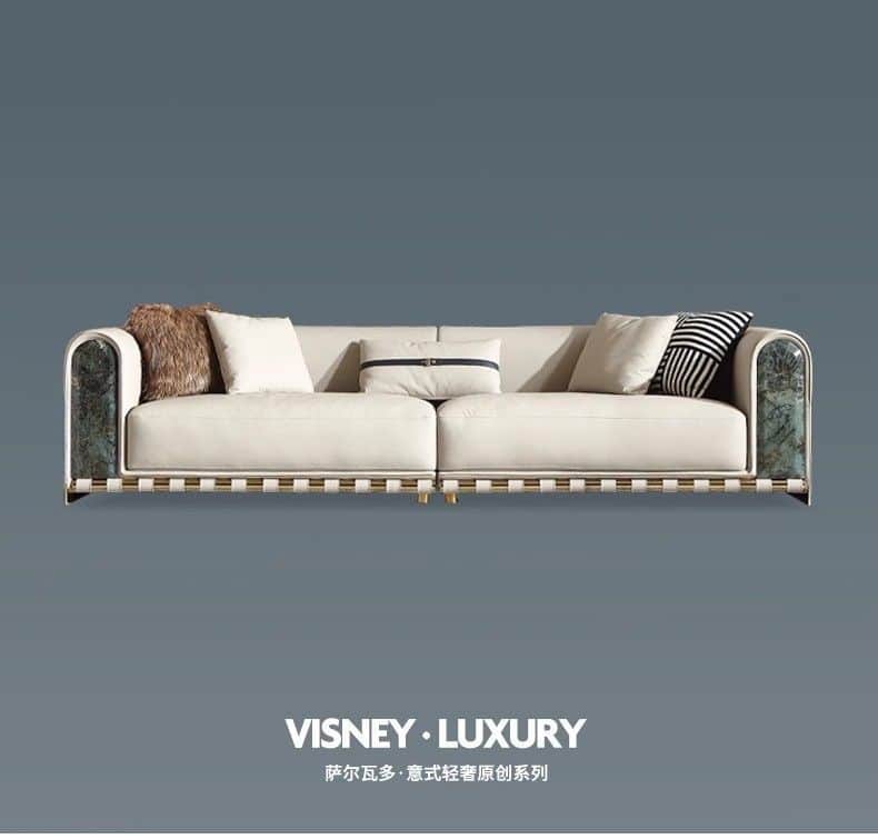 A luxurious modern sofa featuring a cream-colored upholstered body, curved green marble armrests wit… — free BLEND 3D model