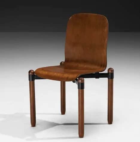 A contemporary chair with a contoured wooden seat and backrest, supported by cylindrical wooden legs… — 3D model