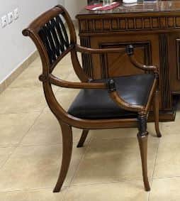 An elegant Neoclassical style armchair featuring a dark wood frame with a black upholstered seat and… — free OBJ 3D model