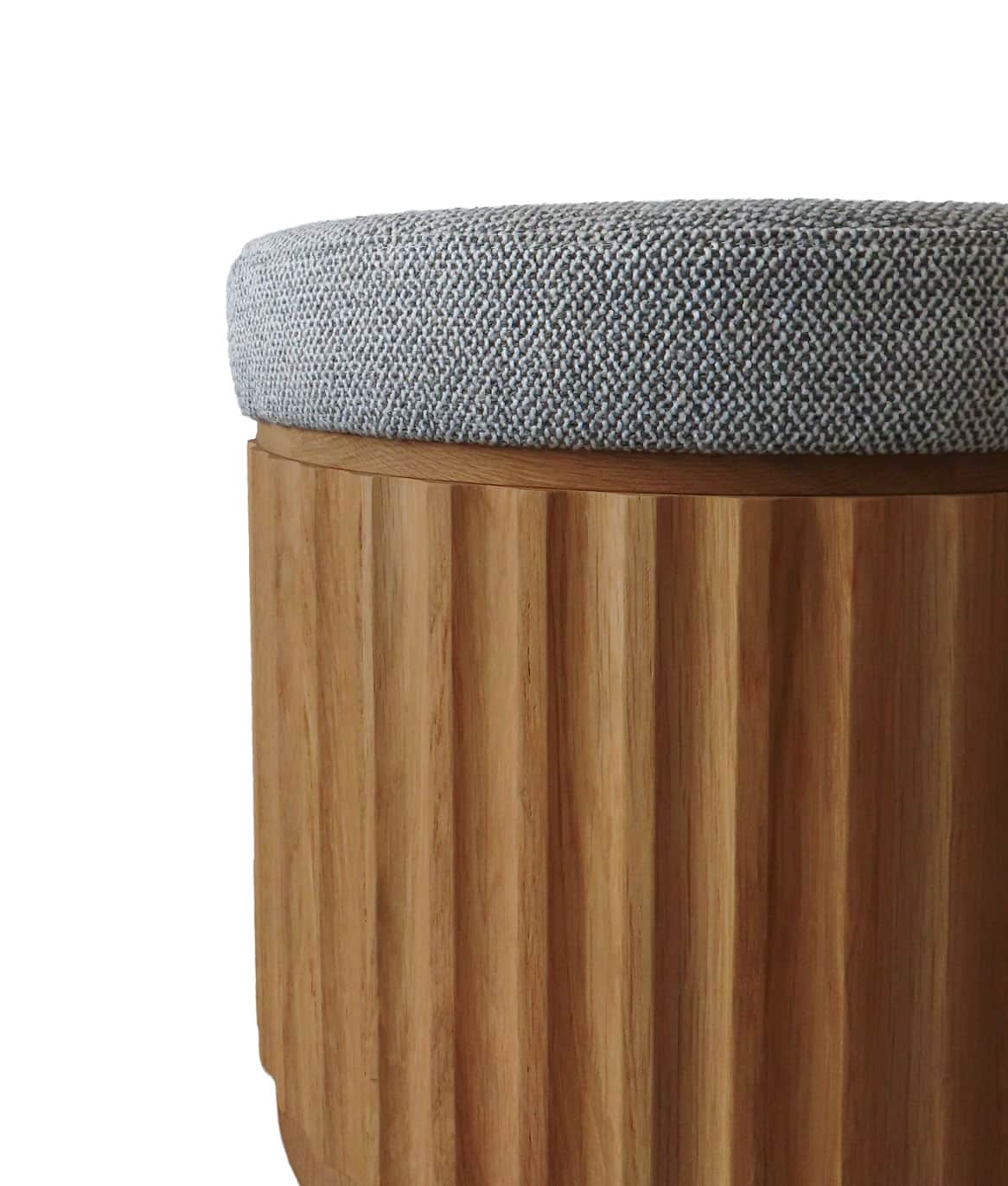 A contemporary round ottoman featuring a distinctive fluted oak wood base and a grey textured uphols… — 3D model