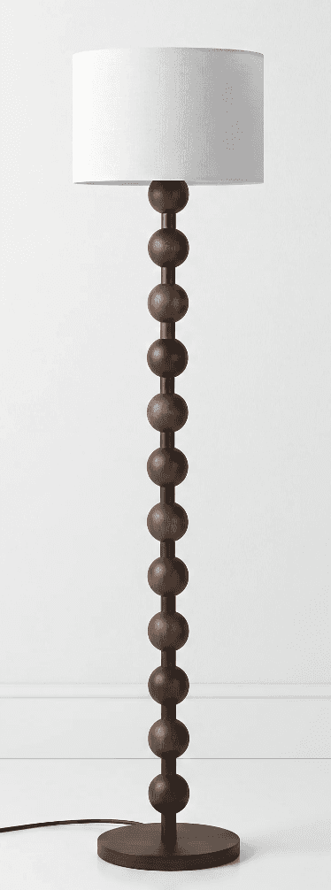 A tall floor lamp featuring a distinctive dark brown wooden stem composed of a series of stacked, sp… — free OBJ 3D model