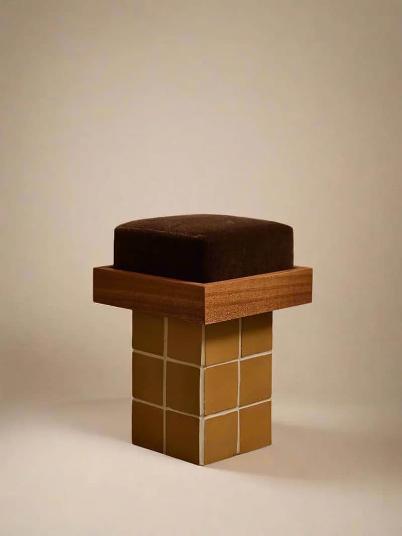 A stool with a square, upholstered seat in a dark brown fabric. The seat rests on a square wooden fr… — 3D model