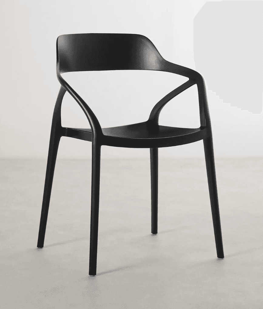 A modern armchair with a molded, single-piece seat and backrest, supported by four slender legs. The… — 3D model