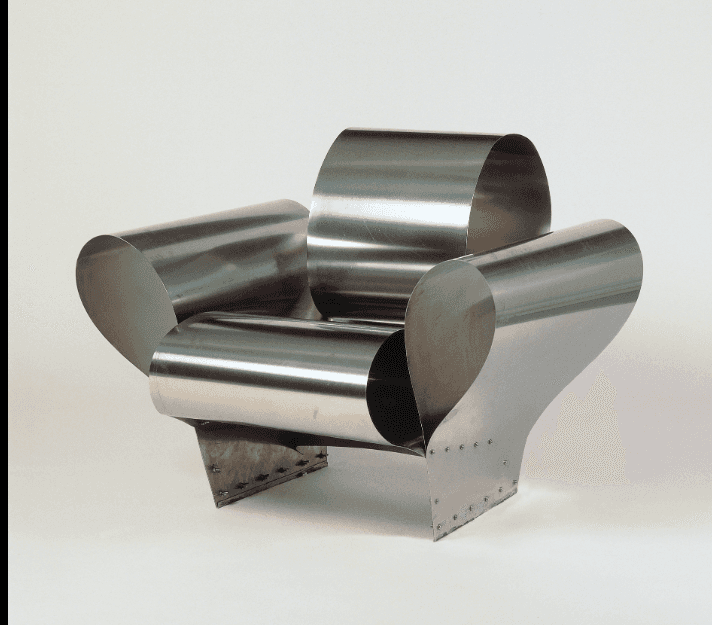 An avant-garde armchair constructed from curved, polished metal sheets. The design features a promin… — 3D model