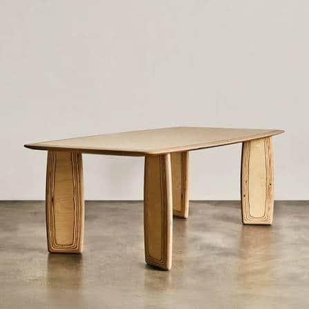 A rectangular dining table crafted from light-colored plywood, featuring a smooth tabletop with gent… — 3D model