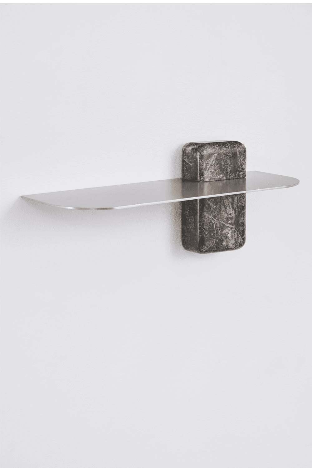 A minimalist wall-mounted shelf featuring a sleek, rectangular metallic surface supported by two rob… — 3D model