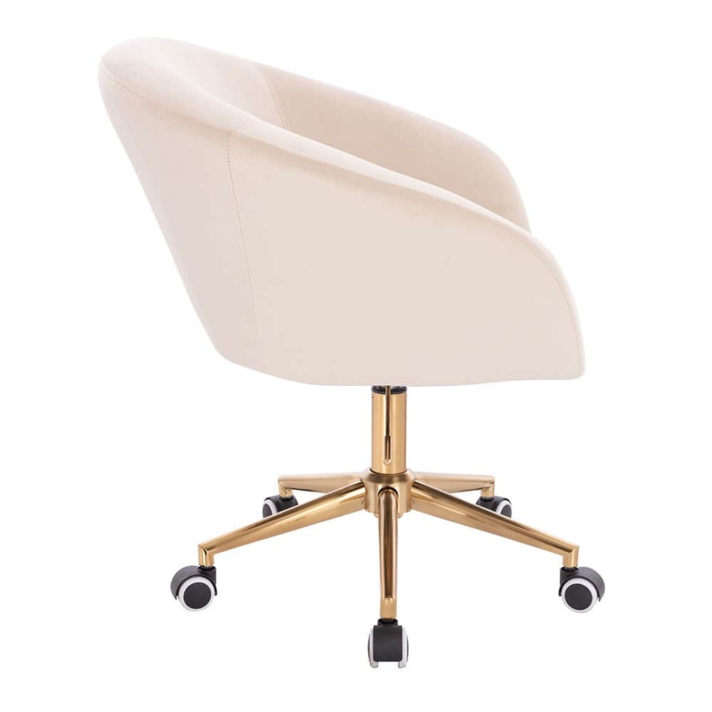 A cream-colored velvet desk chair with a curved backrest and armrests. It features a gold-tone metal… — 3D model