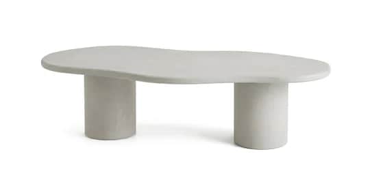 A light-toned, modern coffee table featuring an irregularly shaped top and two robust cylindrical le… — 3D model