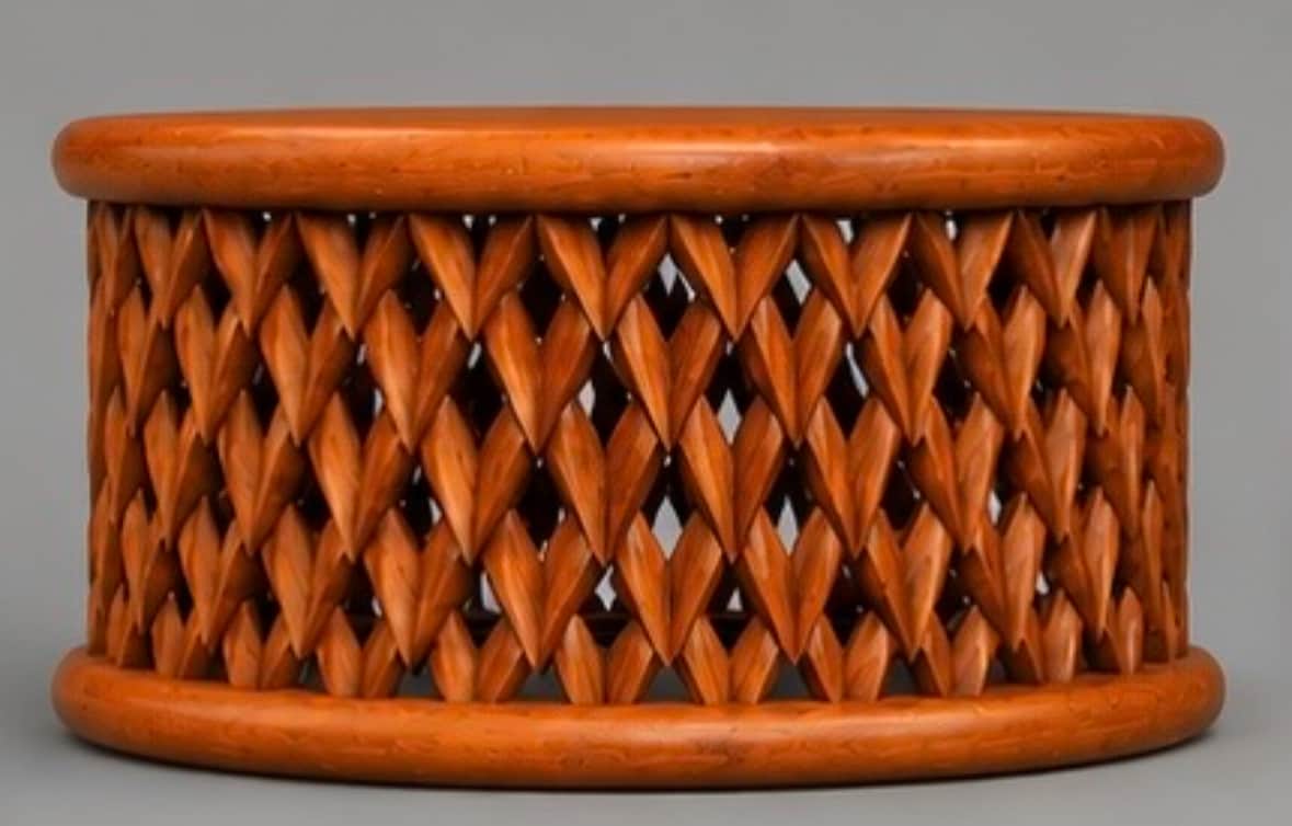 A small, cylindrical wooden table featuring a unique, intricately carved side panel. The top and bot… — free STL 3D model