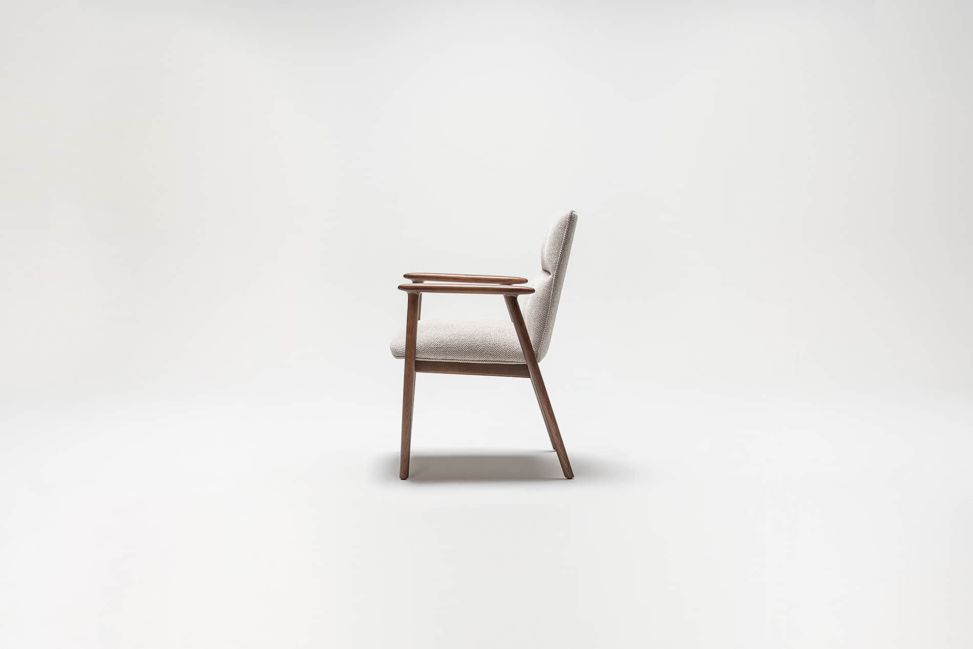 A side profile view of a mid-century modern armchair against a plain white background. The armchair… — free OBJ 3D model