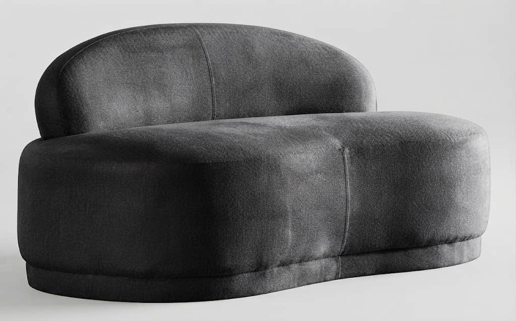 A dark grey upholstered armless lounge chair with a rounded, organic form. It features a low, curved… — 3D model
