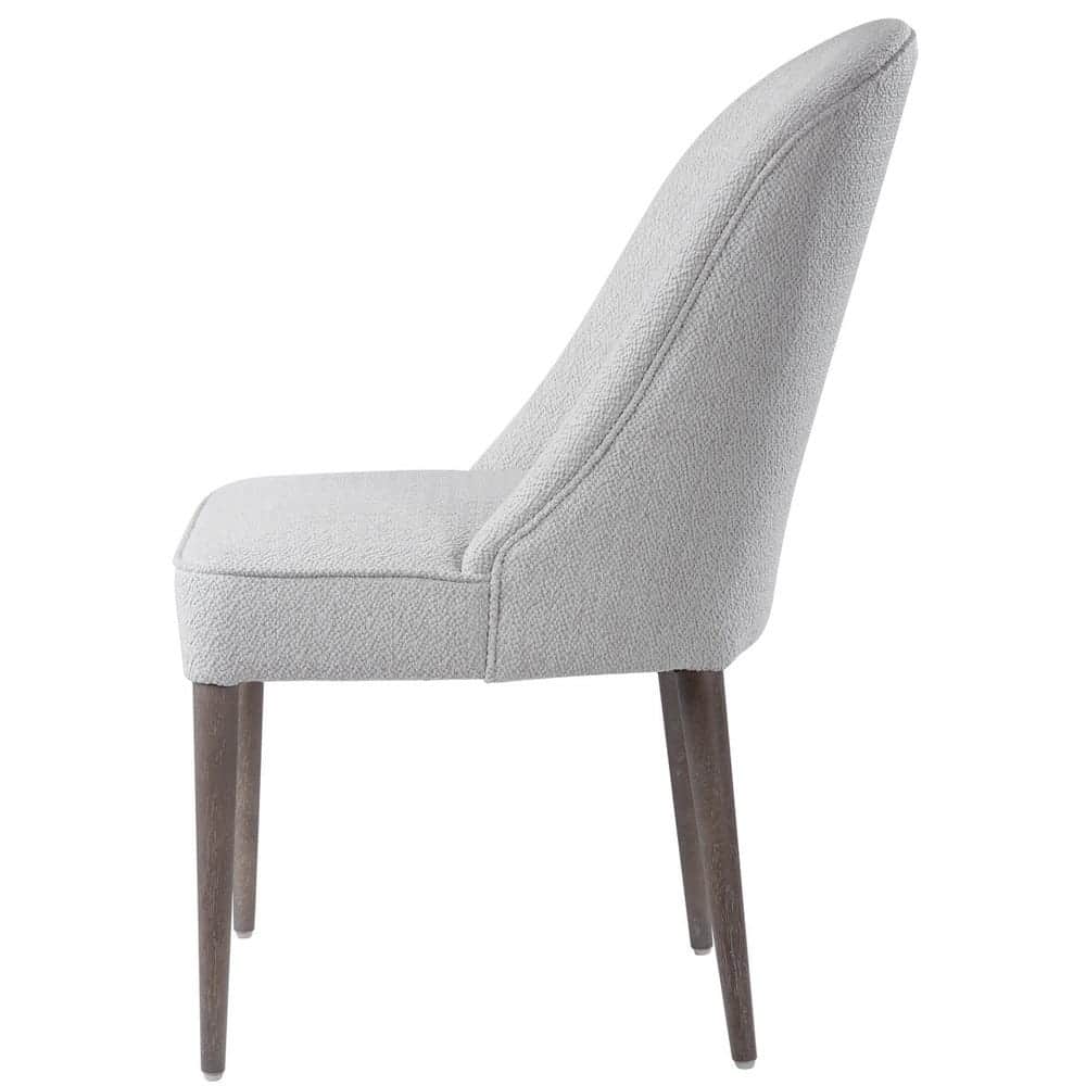 An armless upholstered dining chair featuring a gracefully curved high backrest and a fully cushione… — 3D model