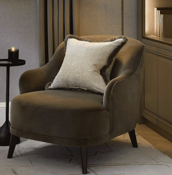 A contemporary tub-style accent chair upholstered in a dark, warm-toned velvet fabric, featuring a r… — 3D model