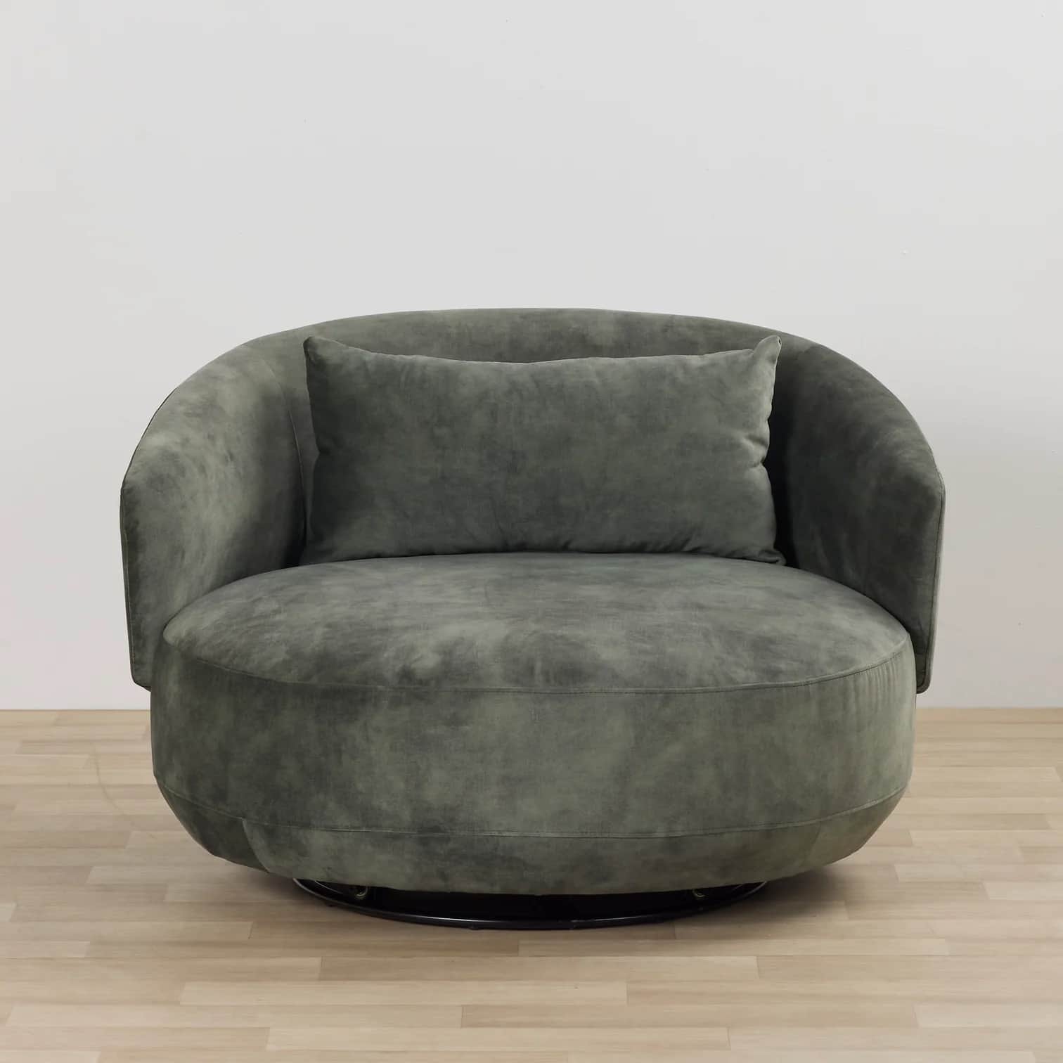 A large, round upholstered swivel lounge chair in a dark gray-green fabric, featuring a continuous c… — 3D model