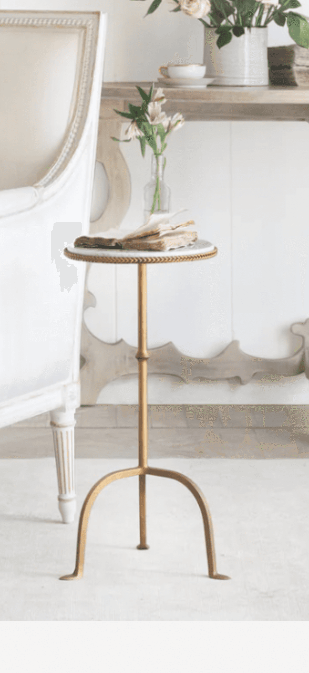 A round side table with a white marble top and a gold-finished metal base. The base has a slender, a… — free GLB 3D model
