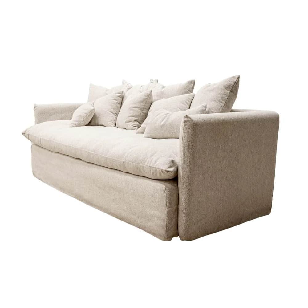A plush, generously sized sofa with a loose, slipcover-like design. It features deep seat cushions a… — 3D model