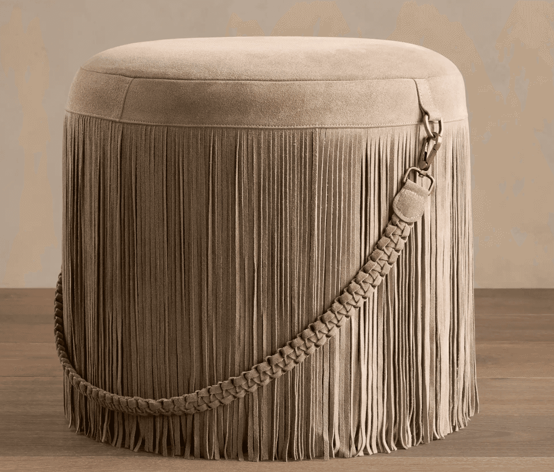 A round, upholstered ottoman featuring a full skirt of long fringe. The top surface is smooth and up… — 3D model