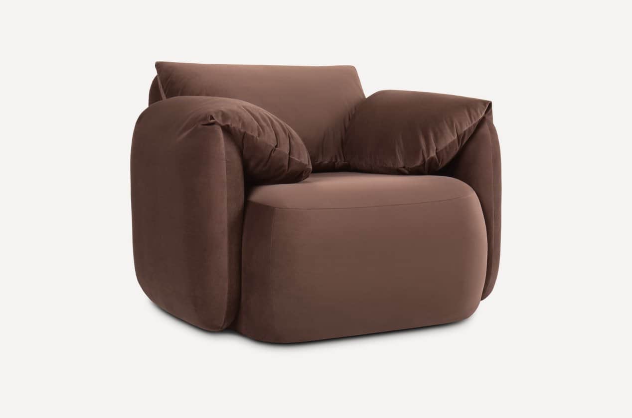 A contemporary armchair with plush upholstery and generous cushioning. The armchair features rounded… — 3D model