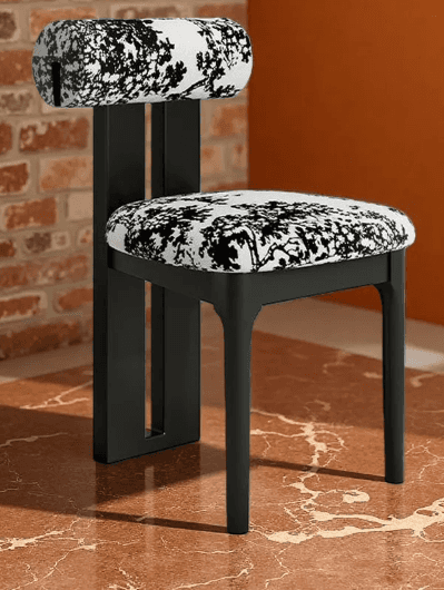 A modern chair with a minimalist black frame and upholstered seat and backrest. The upholstery featu… — free FBX 3D model