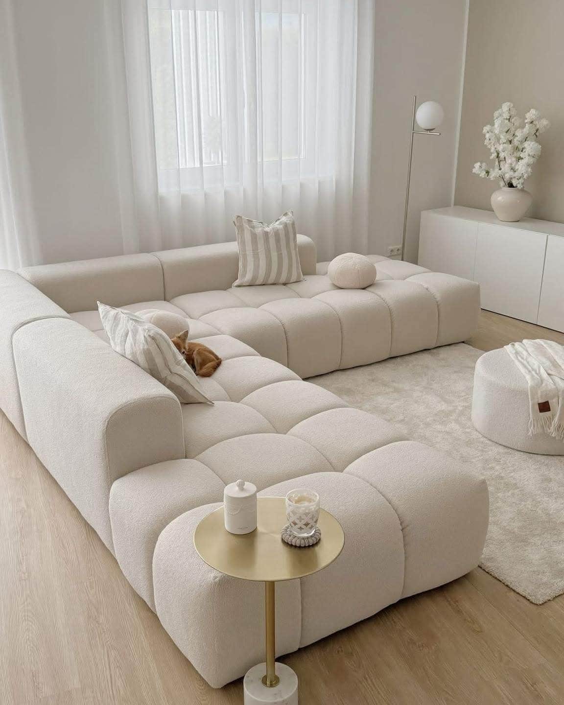 A modular sectional sofa with a low profile and generous depth. The sofa features a tufted, pixelate… — 3D model