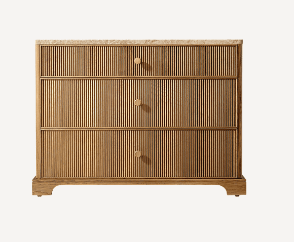A modern chest of drawers featuring three full-width drawers with reeded fronts, a beige marble top,… — 3D model