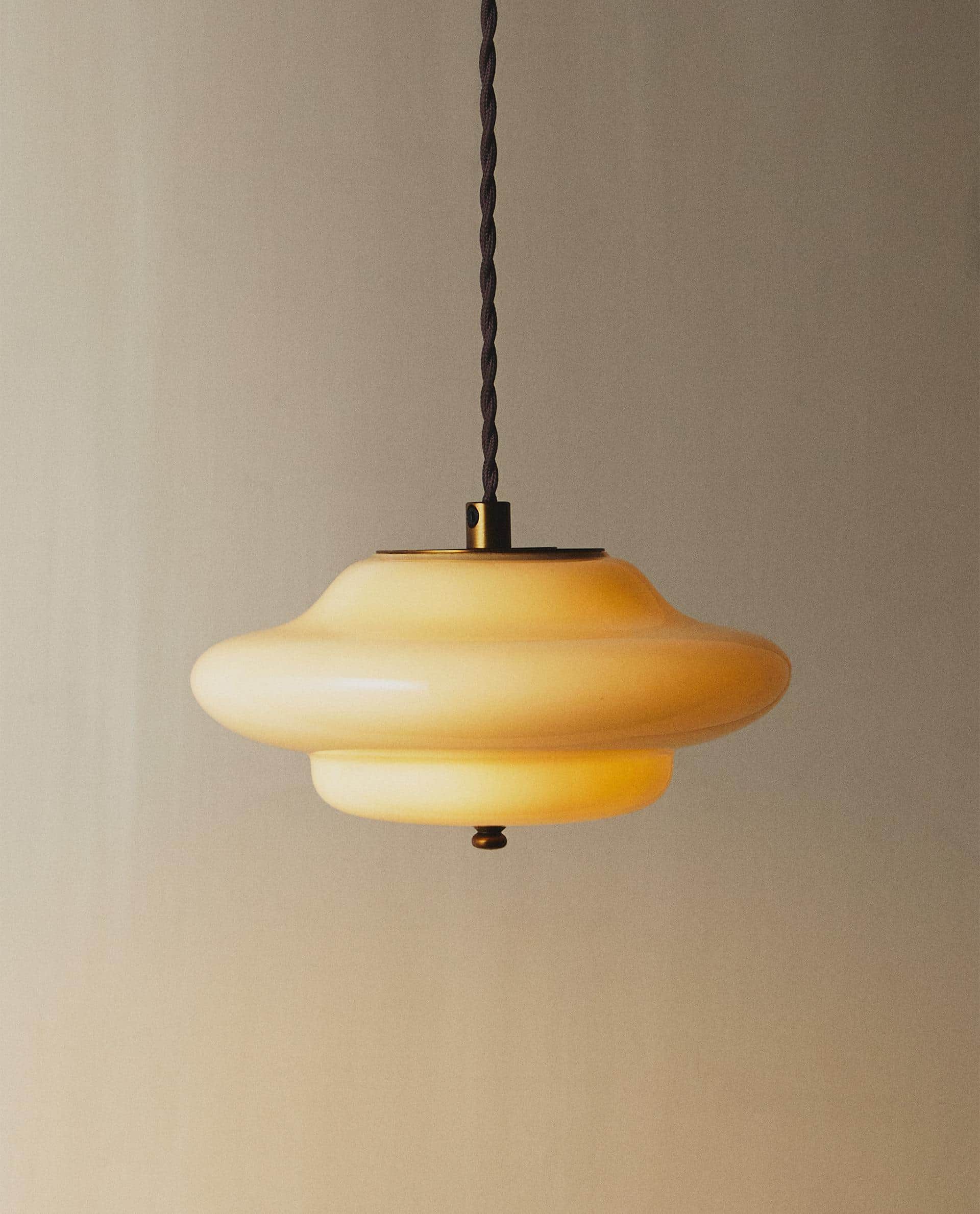 A ceiling-mounted pendant light featuring a multi-tiered, saucer-shaped shade crafted from opalescen… — free GLB 3D model