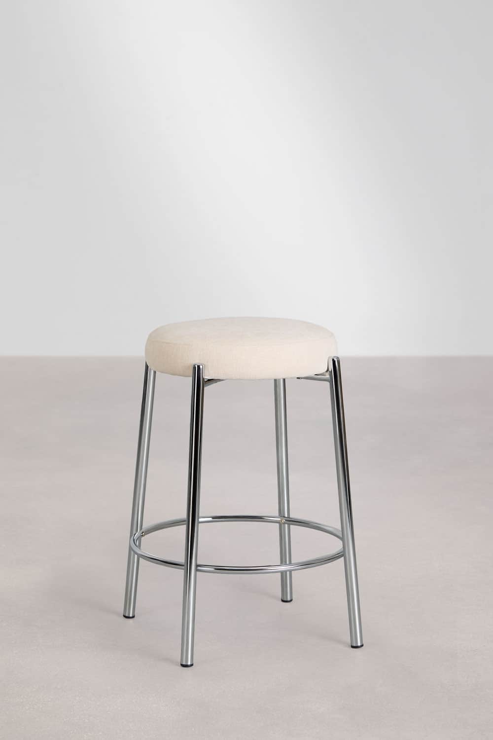 A modern bar stool featuring a round, upholstered seat in a light, neutral fabric, supported by a po… — 3D model