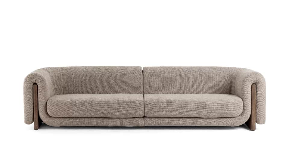 A contemporary modular two-seater sofa upholstered in a light beige/taupe textured fabric, featuring… — 3D model