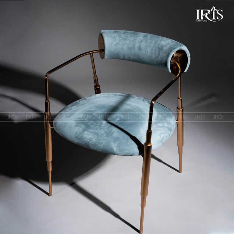 A contemporary armchair featuring light blue velvet upholstery on its circular seat and cylindrical… — 3D model