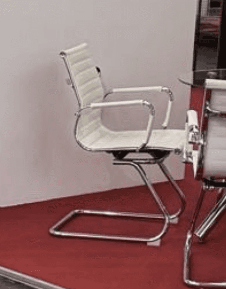 A modern white ribbed armchair featuring a distinctive sled base and integrated armrests, rendered a… — 3D model