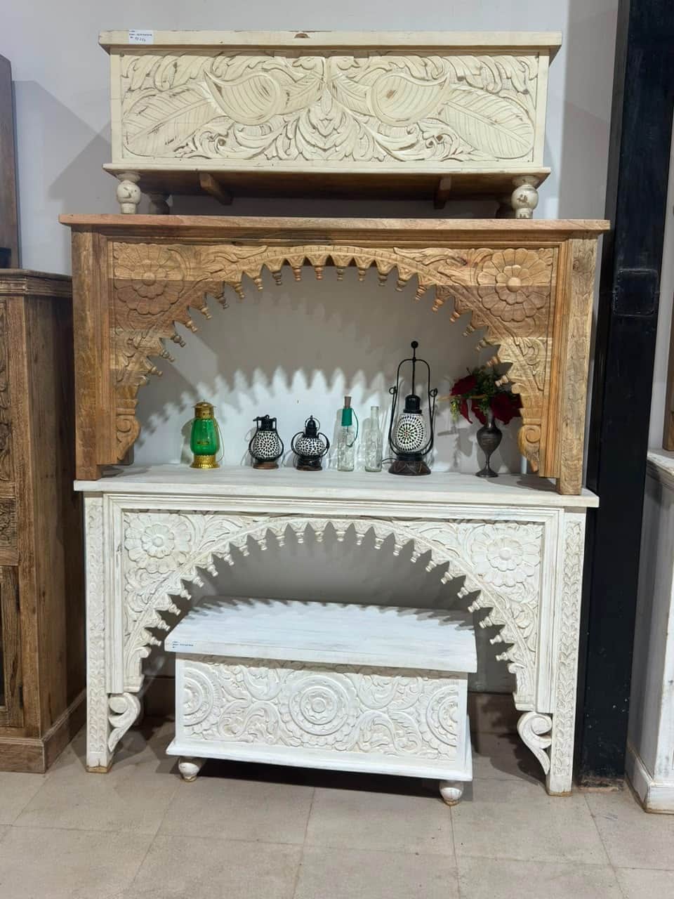 A narrow console table featuring a distinctive arched front intricately carved with floral and vine… — 3D model