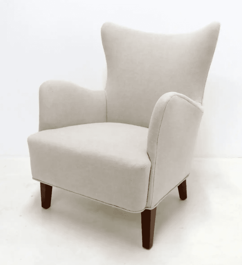 A single wingback chair with a high back and upholstered arms, standing on four short wooden legs. T… — free OBJ 3D model