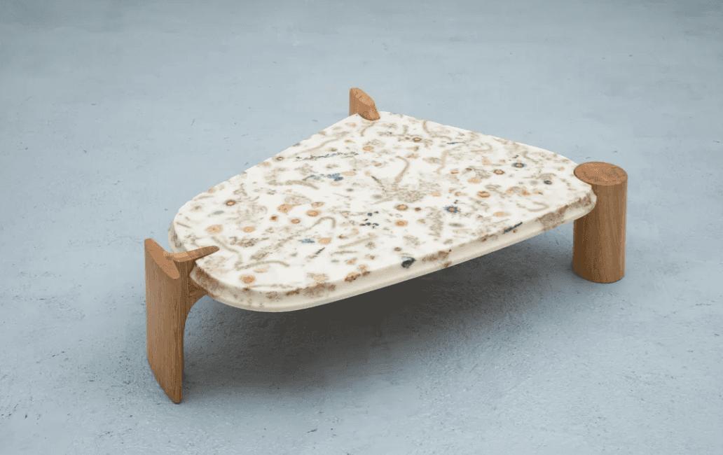 A unique side table with an irregularly shaped top and wooden legs. The tabletop appears to be made… — 3D model
