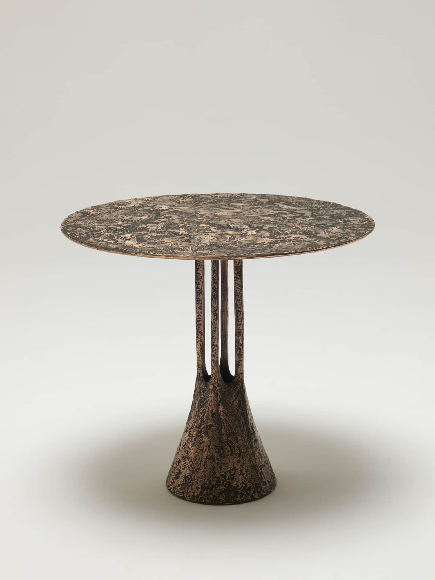 A striking pedestal side table featuring a round top and a conical base, both exhibiting a heavily t… — 3D model