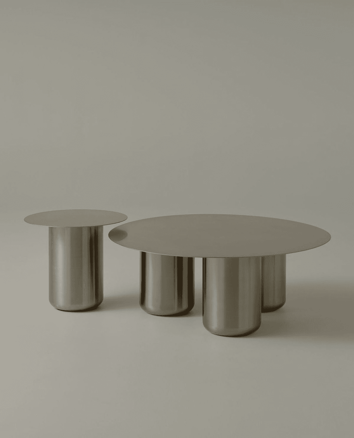 A contemporary coffee table set consisting of a larger, round coffee table and a smaller, side table… — free BLEND 3D model