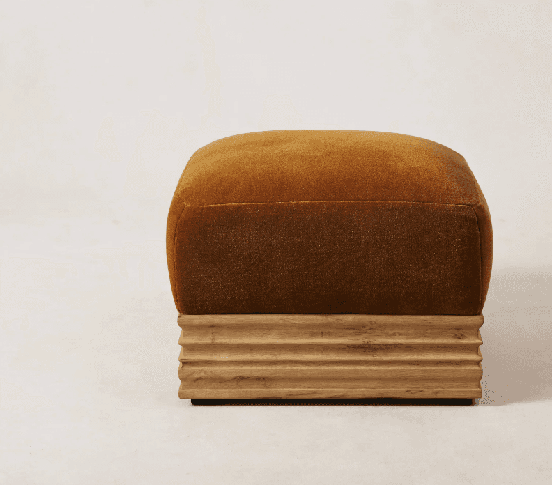 A square-shaped ottoman with a plush, upholstered top and a fluted wooden base. The upholstery is a… — free OBJ 3D model