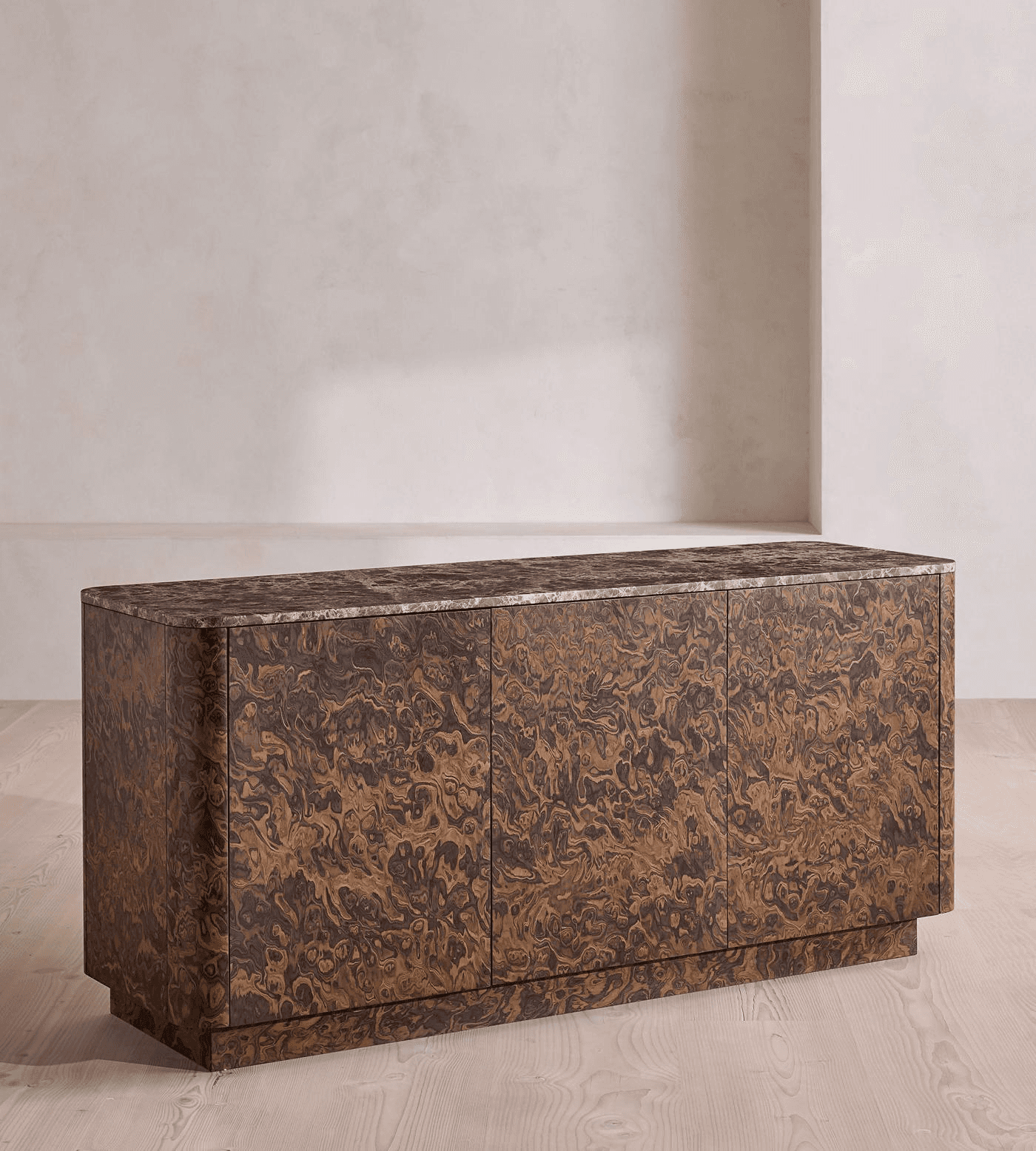 A credenza with a highly figured burl wood veneer on its body and three doors. The top surface appea… — 3D model