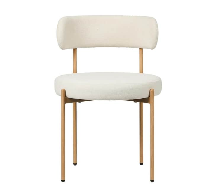 A contemporary accent chair featuring a boucle upholstered seat and backrest, supported by slender,… — 3D model