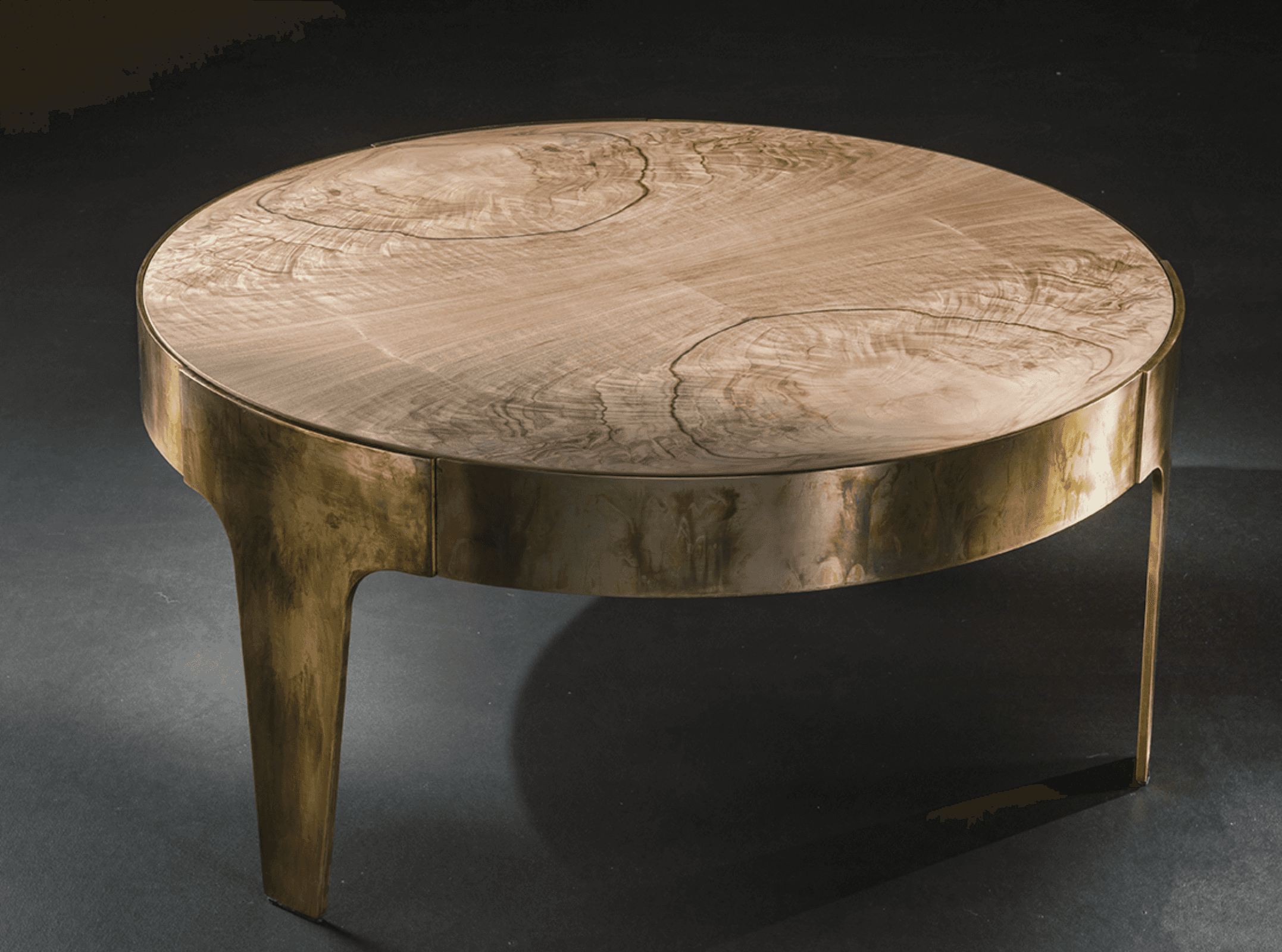A round coffee table featuring a light-toned natural wood top with prominent grain patterns, support… — 3D model