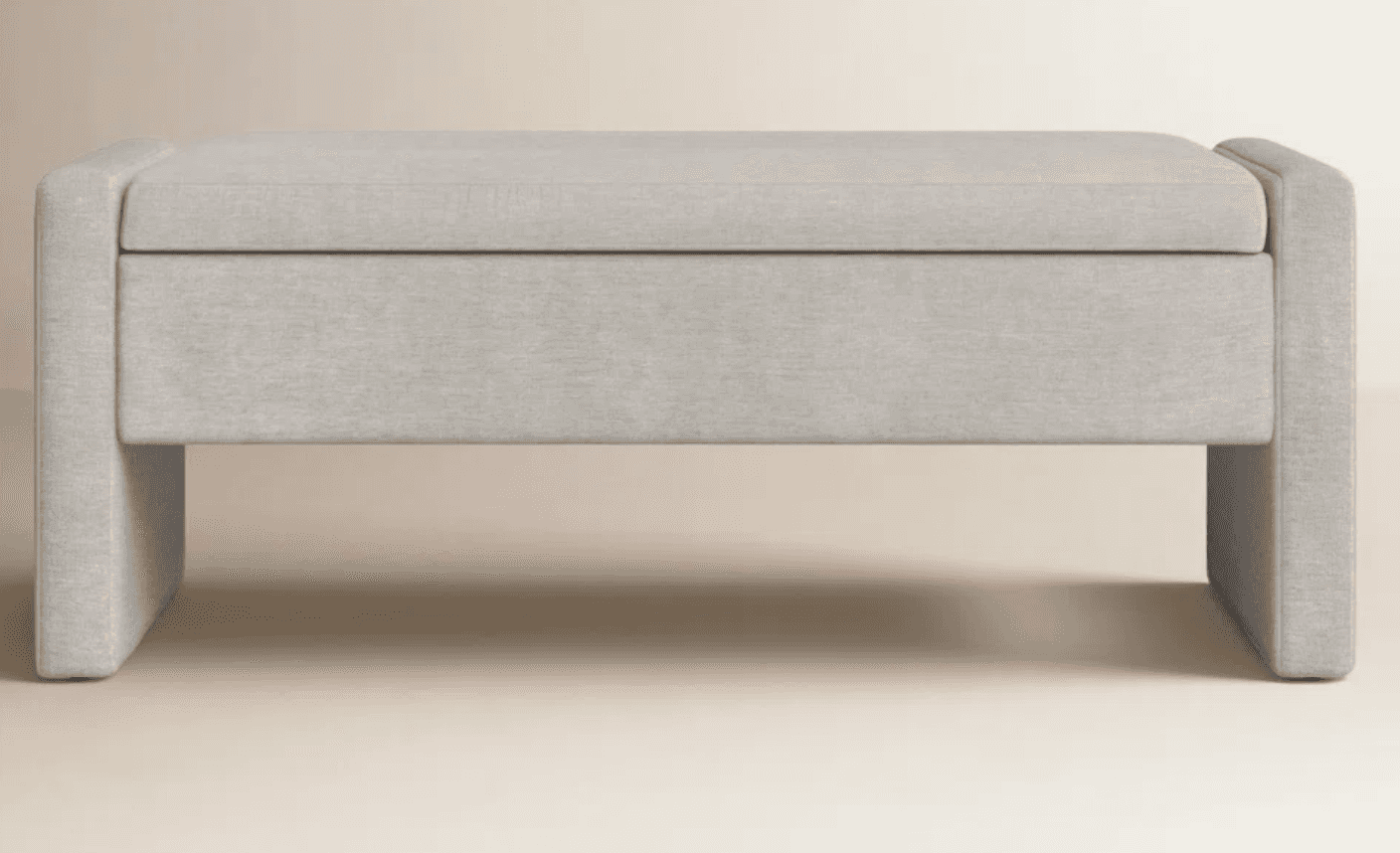 An upholstered rectangular storage ottoman with a lift-top, entirely covered in a light grey fabric,… — 3D model