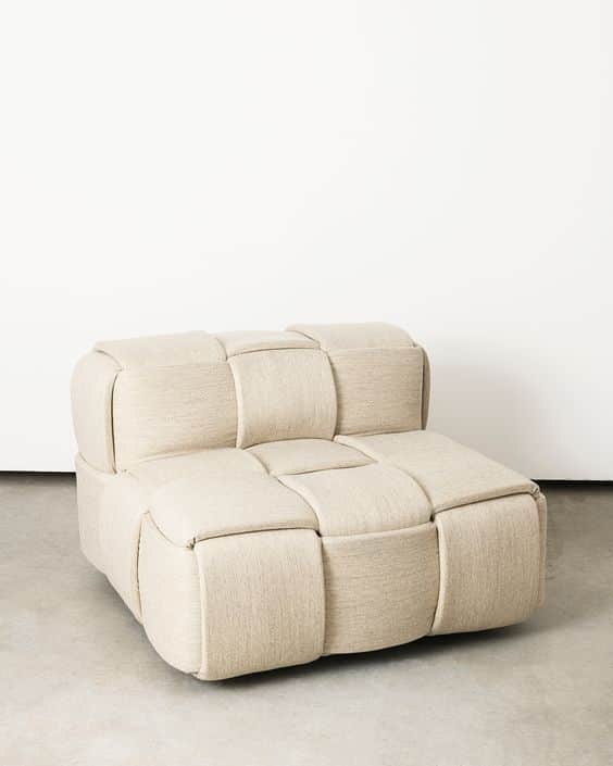 A modular armchair with a unique woven design. The armchair features a low profile and is upholstere… — 3D model