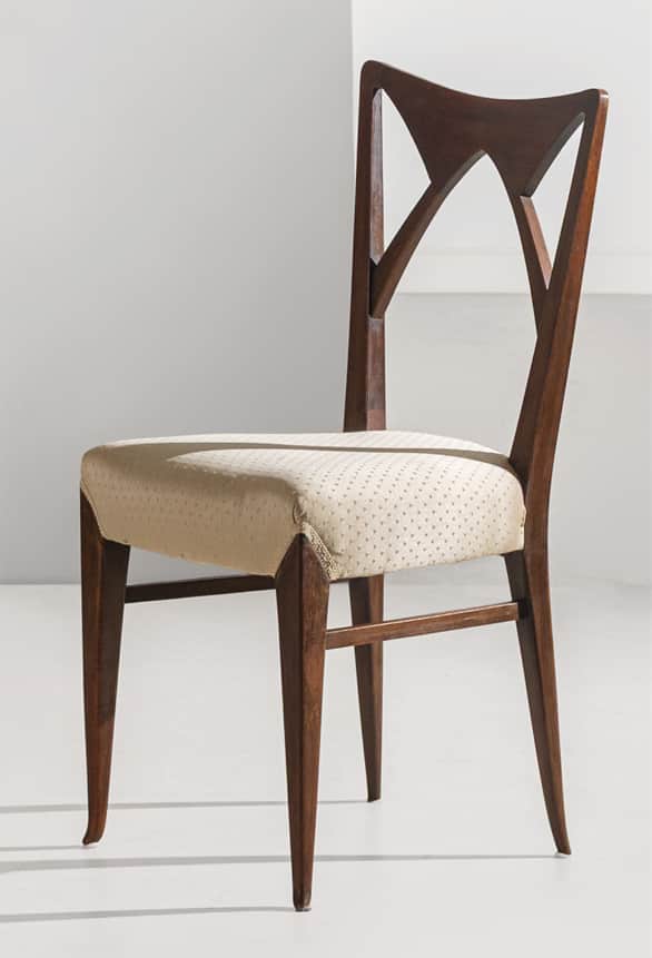 A Mid-Century Modern style dining chair featuring a dark wood frame and an upholstered seat. The bac… — 3D model