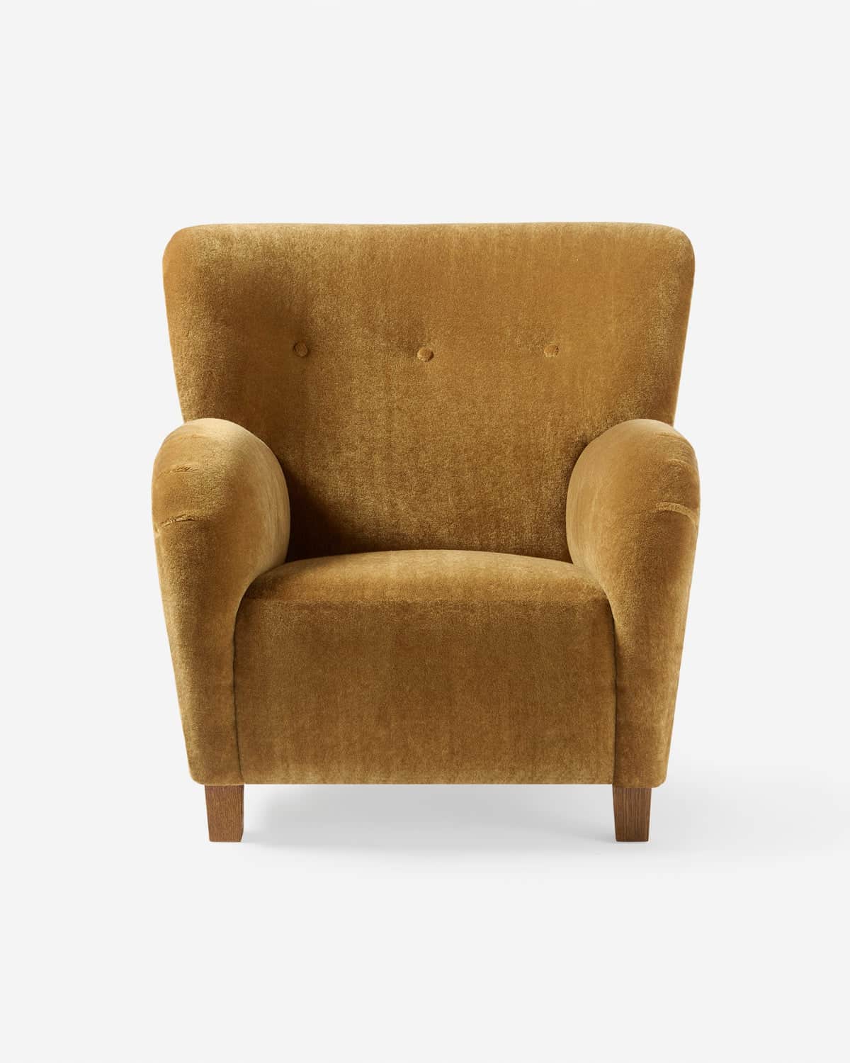 A comfortable lounge chair upholstered in a plush golden-brown velvet fabric, featuring a high backr… — 3D model