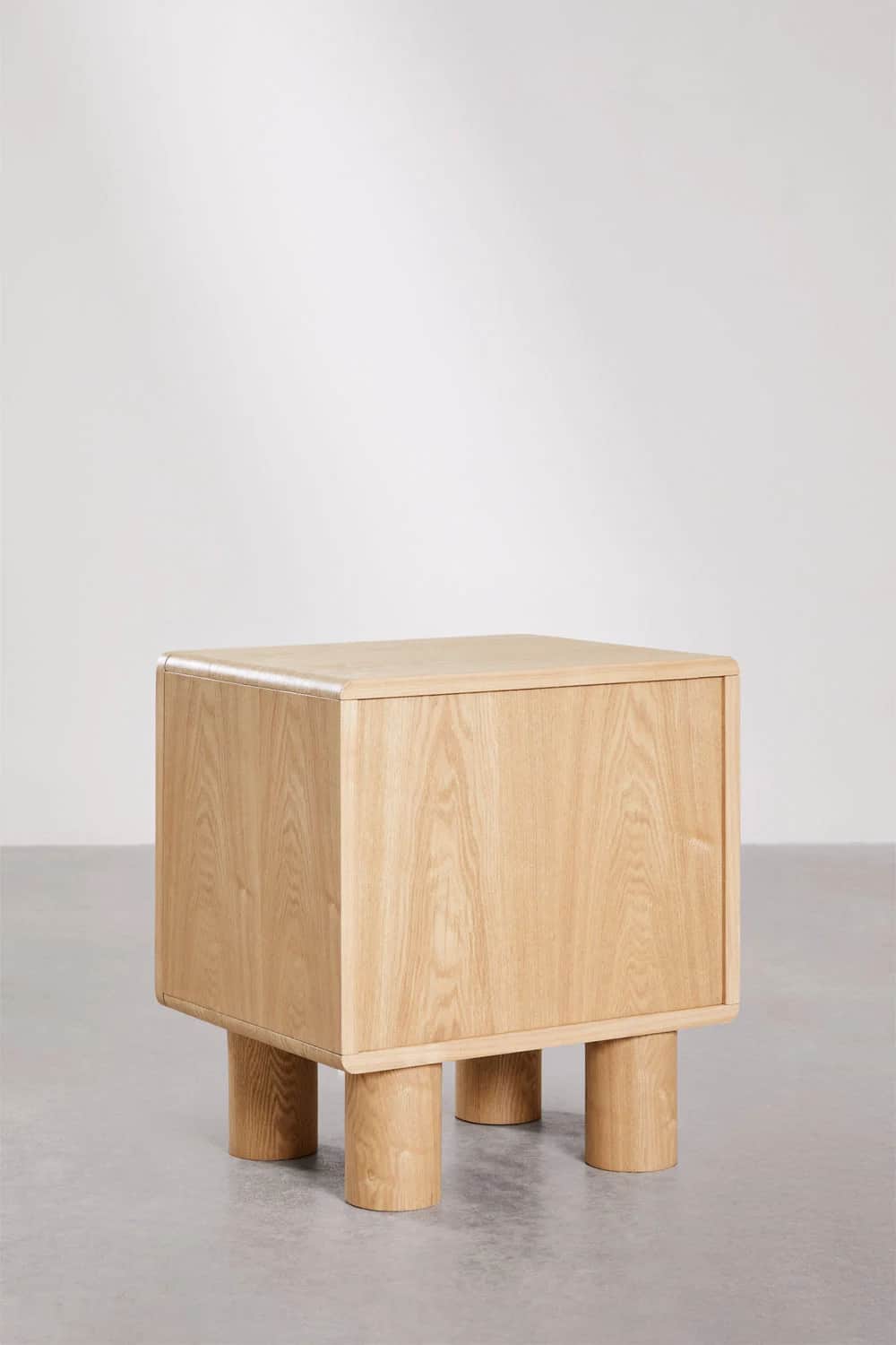 A contemporary nightstand with a cuboid main body and four cylindrical legs. The top and side panels… — 3D model