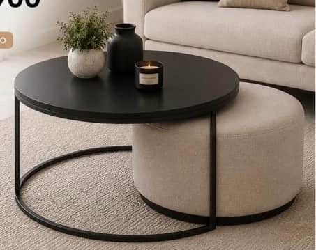 A modern nesting furniture set consisting of a round coffee table with a black metal frame and a cir… — free GLTF 3D model