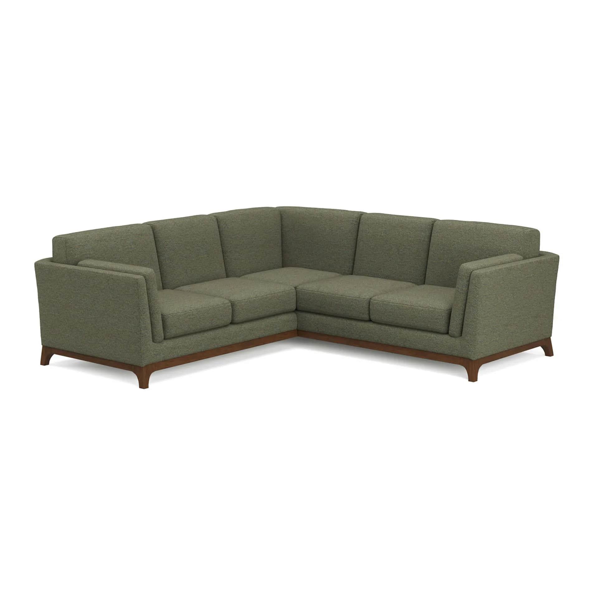 A contemporary L-shaped sectional sofa upholstered in olive green fabric, featuring a minimalist des… — 3D model
