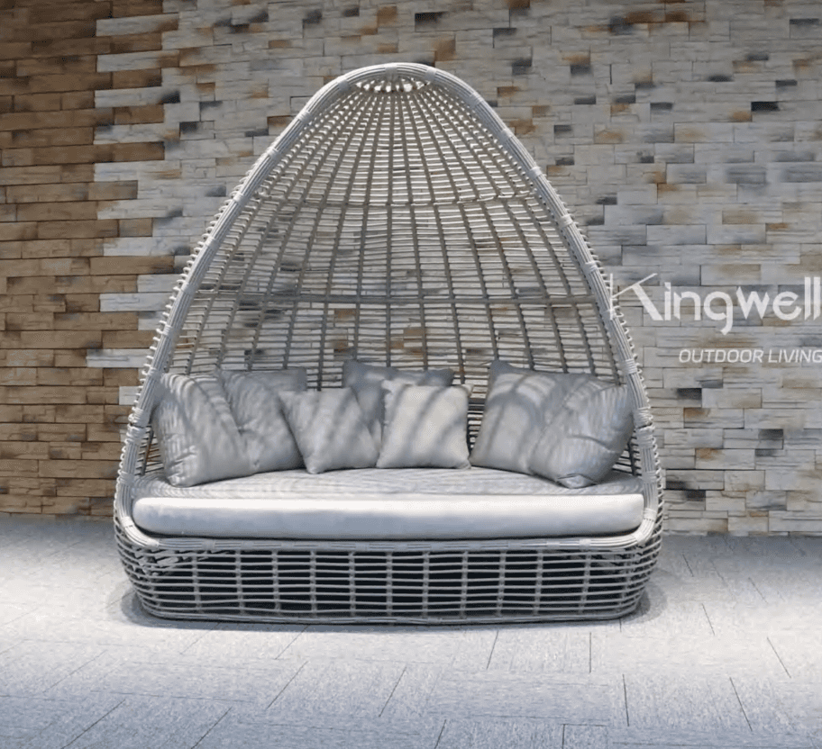 A white, woven daybed with a rounded, cocoon-like canopy structure. It features a large, upholstered… — 3D model