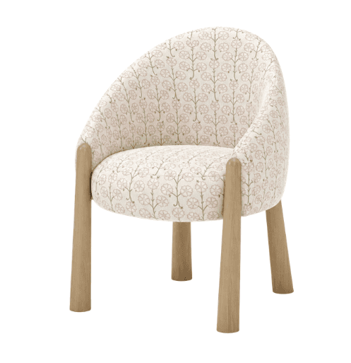 A petite armchair with a rounded back and seat, upholstered in fabric with a repeating floral patter… — 3D model