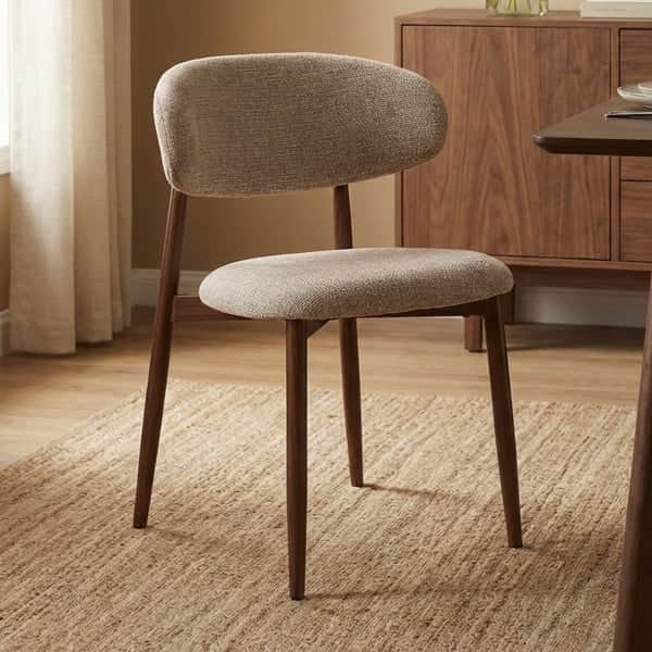 An armless dining chair featuring a dark wood frame with tapered legs and upholstered seat and backr… — 3D model