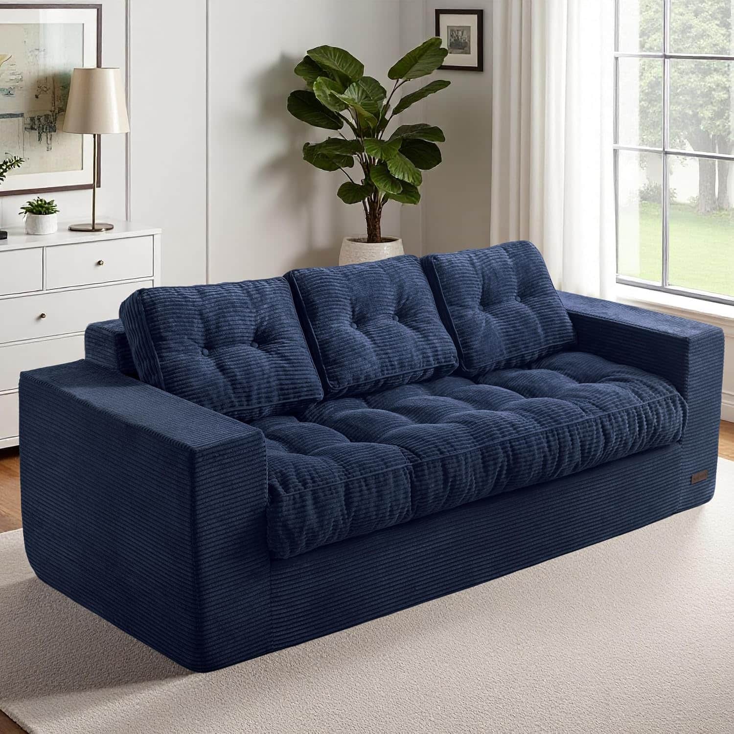 A contemporary three-seater sofa upholstered in a navy blue wide-wale corduroy fabric, featuring dee… — free OBJ 3D model